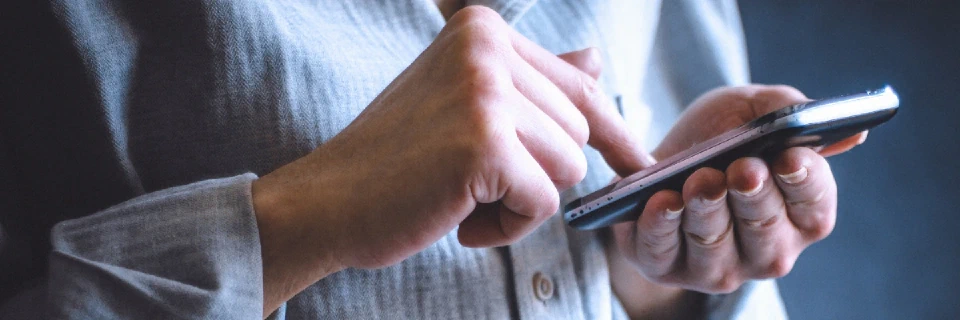 Person texting on phone sms