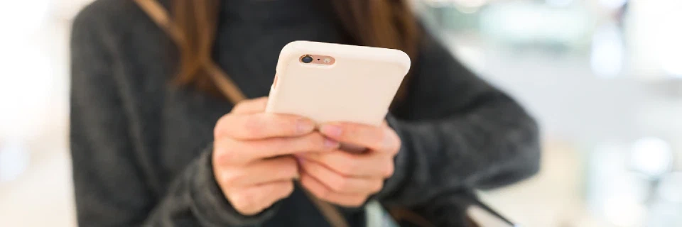 People texting via sms services on their mobile phones