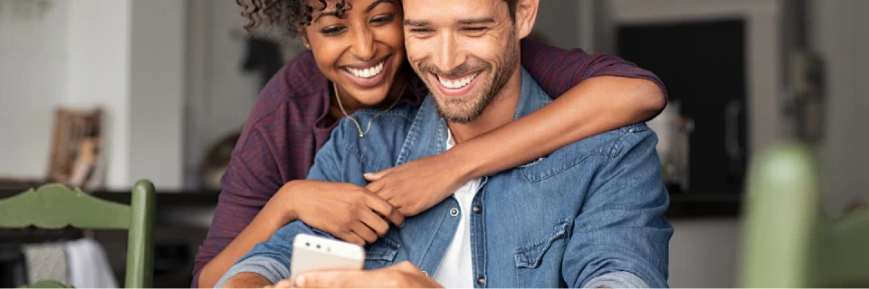 partners excited interacting with mobile phone experience