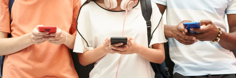 group of people looking phone